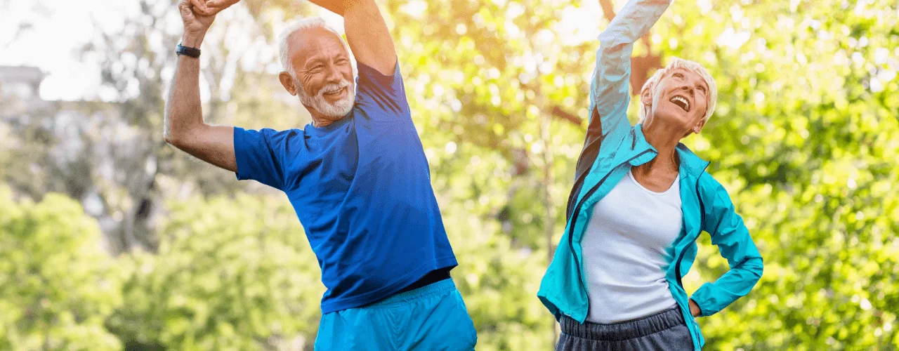 An old couple doing exercise in park