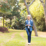 An old lady taking a walk in the park